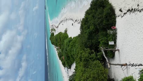 white sand and blue water of lush long beach on dhigurah island, maldives