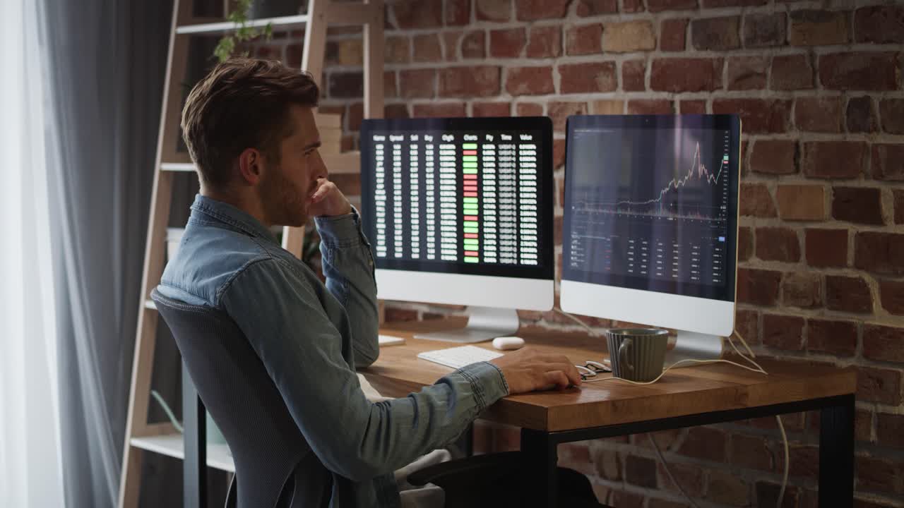 Adult man following stock market data