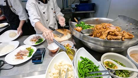 chef assembles traditional thai stewed pork dish