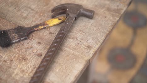 carpenter brush and hammer on a table