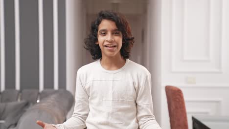 excited indian kid youtuber making a vlog for his channel