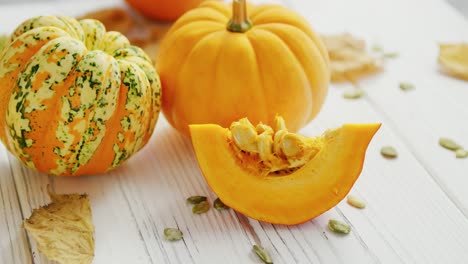 yellow pumpkins laid on table