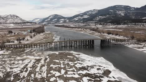 crossing the majestic south thompson river: vehicles on the wooden pritchard bridge