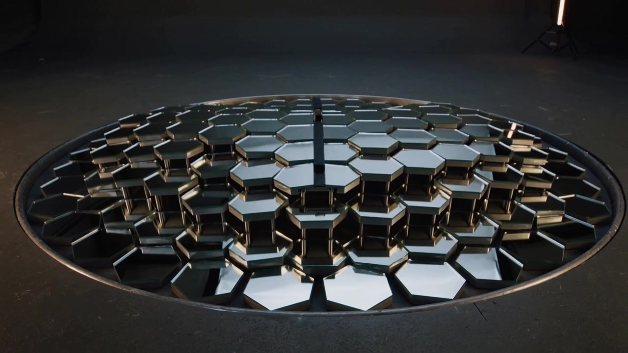 Kinetic Sculpture with Moving Metallic Hexagonal Tiles