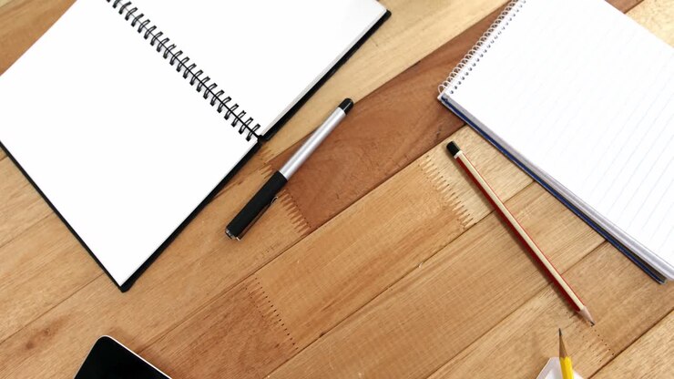 Diary with pencil and pen