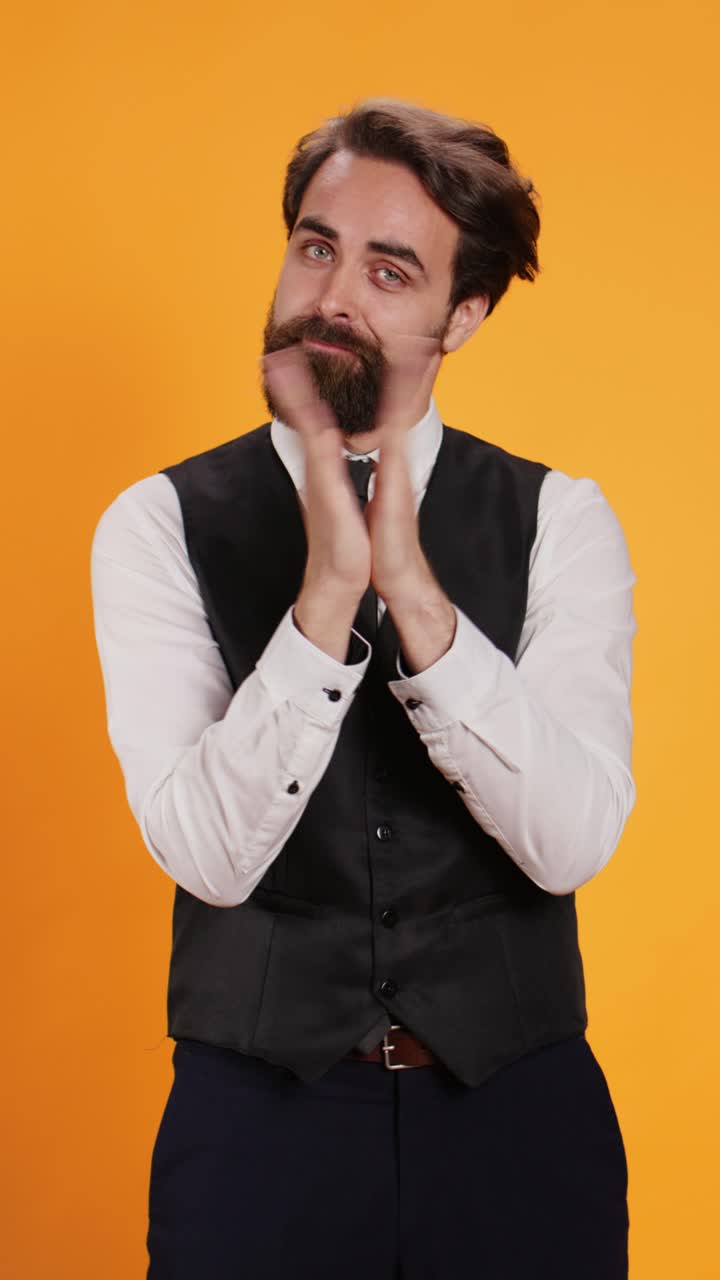 Vertical video Friendly waiter applauding his hands