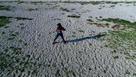 Drone-shot-of-young-attractive-black-female-doing-sports-outdoors