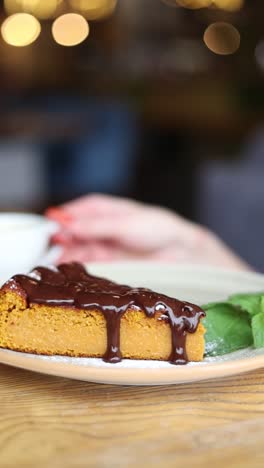 slice of chocolate pumpkin cake with coffee