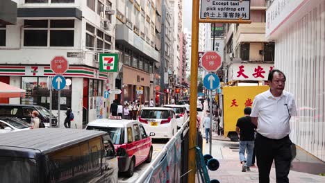 pedestrians and vehicles in bustling urban environment