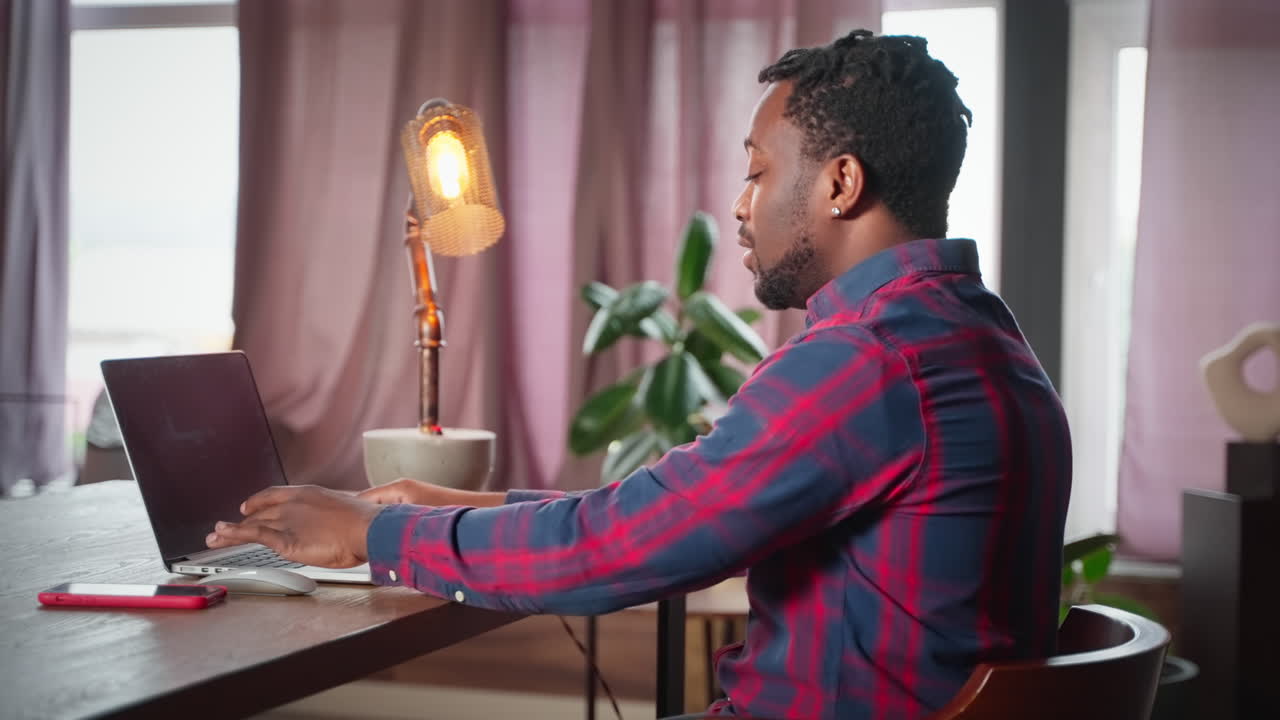Man Working from Home on Laptop