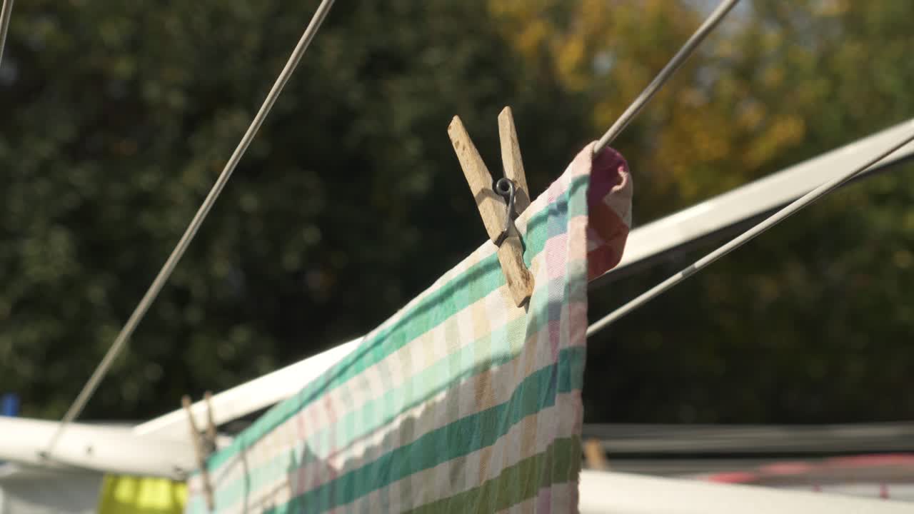 Colorful Towel With Clothespin Hang To Dry Outdoor