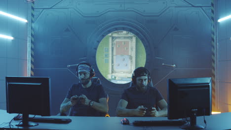 young men playing a match at a gaming tournament medium shot of young men playing a match at a gaming tournament and then doing fail handshake