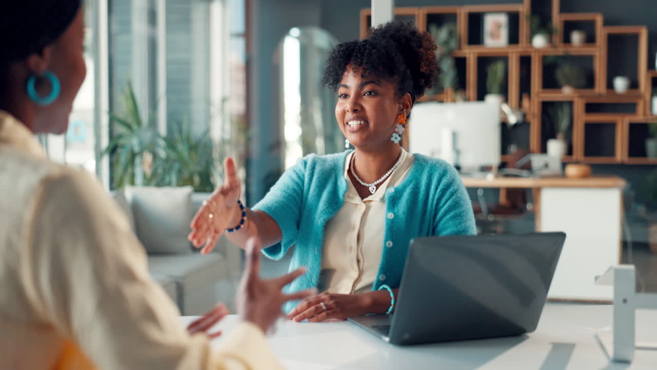Smiling Businesswoman Shaking Hands During an Office Meeting