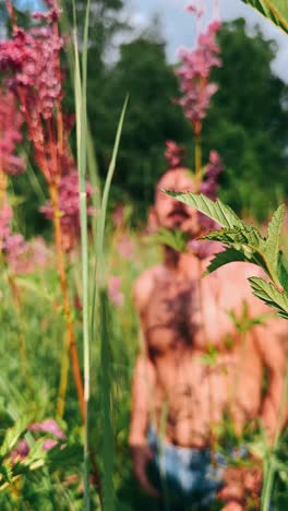 man in a field of flowers