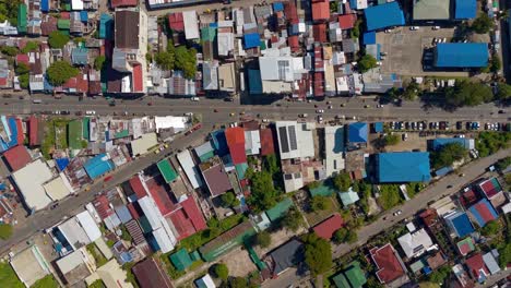 Overhead-shot-of-the-streets-and-buildings-of-Surigao-City-in-the-Philippines,-aerial-top-down