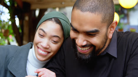 young couple having fun in cafeteria 4k