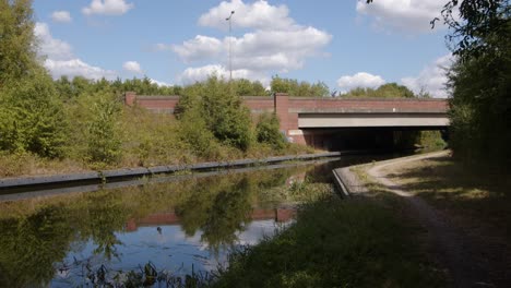 shot of the trent and mersey canal going under the a 50 due carriageway