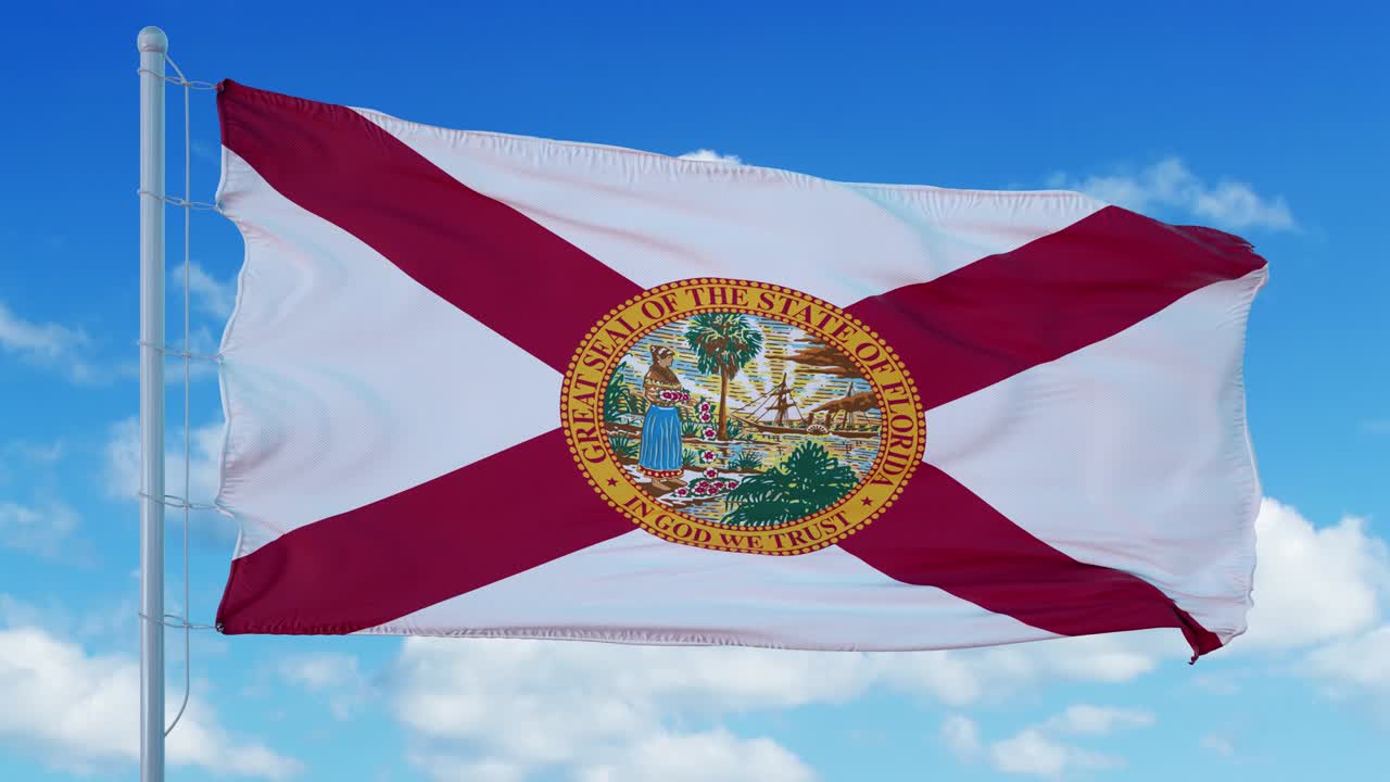 la bandera de florida ondeando en el viento, el fondo del cielo azul. 4k
