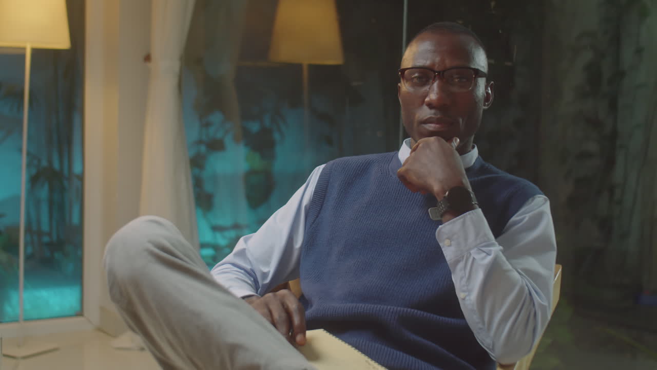 Black Male Psychologist Posing on Camera at Work
