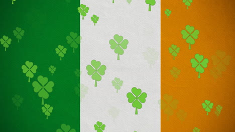 digital animation of multiple clover leaves floating against irish flag