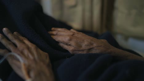 elderly male hands with an iv catheter.