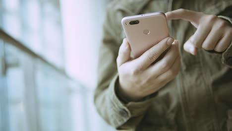 man using smartphone on metro station