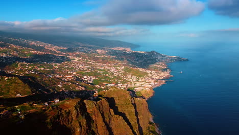 splendid scenery of an inhabited area on the rocky valley. spectacular view of the coast of the madeira islands, portugal from top.