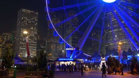 china night illumination hong kong city famous ferris wheel crowded panorama 4k