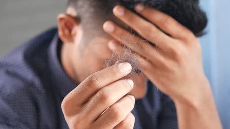 man experiencing hair loss