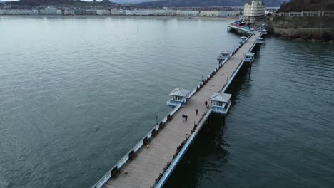 llandudno pier welsh victorian boardwalk resort promenade aerial low tracking view