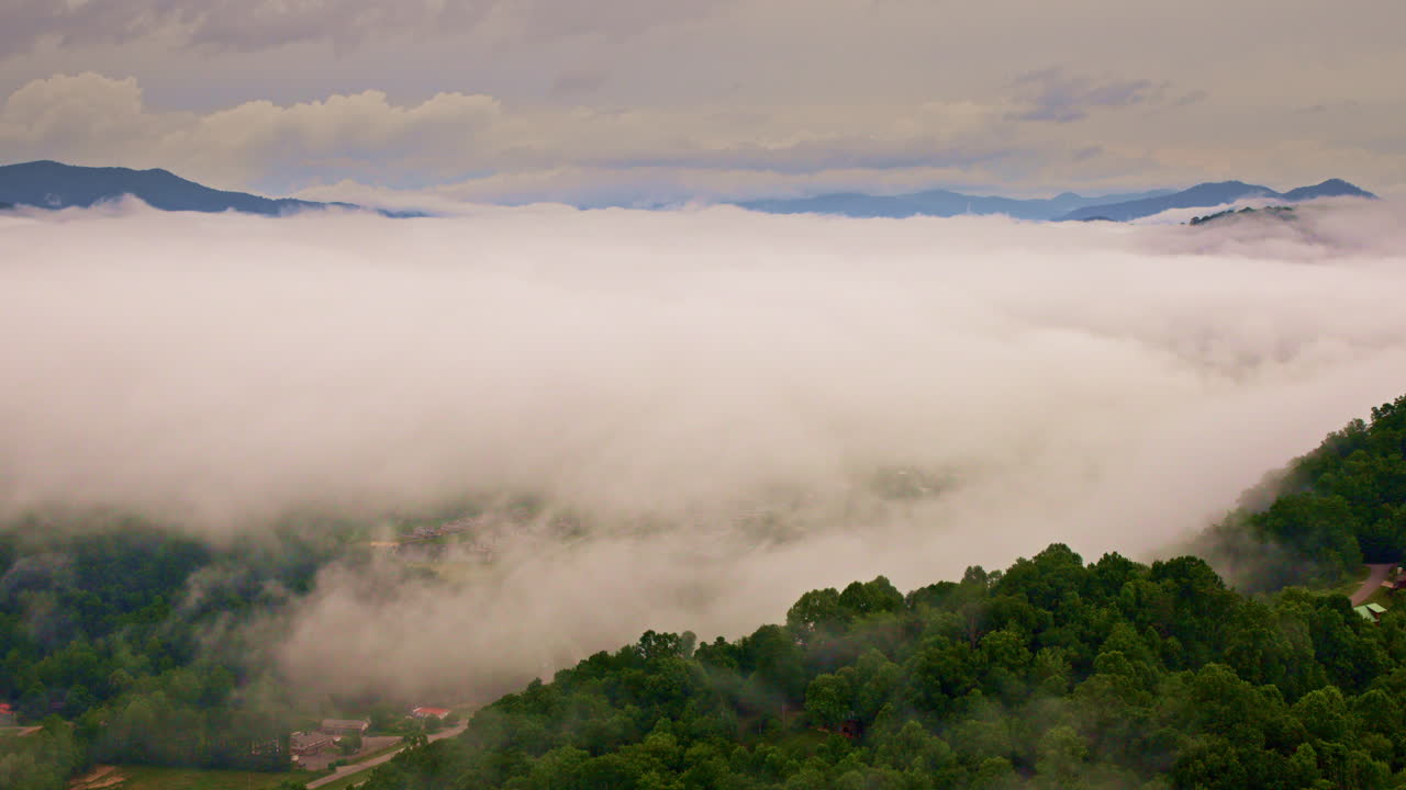 Aerial drone sweep through timeless mist in the Smokies