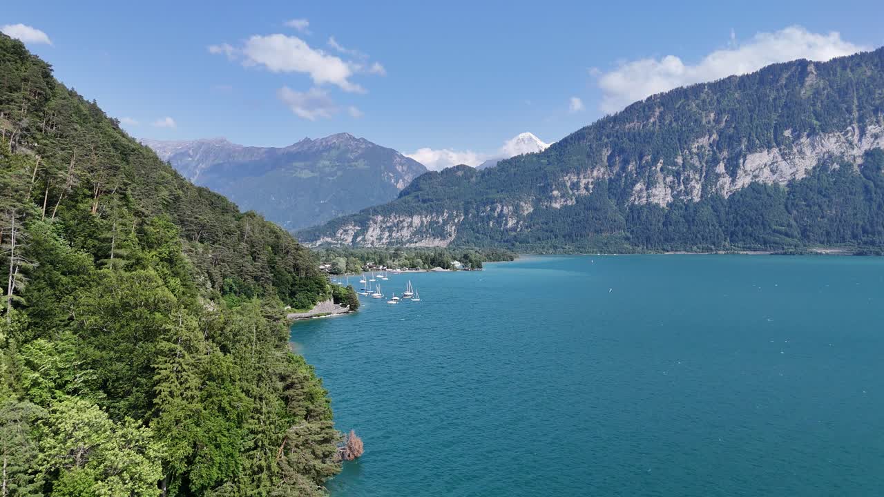 Lake Thun turquoise water Interlaken Jungfrau region Switzerland Panning drone aerial