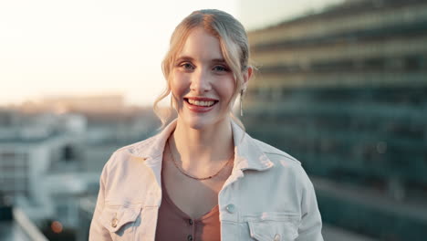 Portrait of a smiling blonde woman in a city setting
