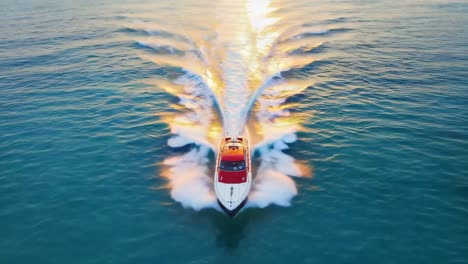 high-speed powerboat leaving a wake on water at sunset