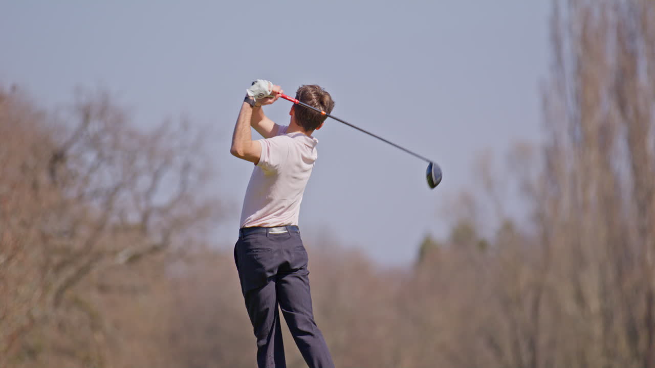 Young golfer playing on a sunny spring day in Switzerland, showcasing precise chipping, putting, bunker, and approach shots. Perfect for sports, lifestyle, and outdoor themes.