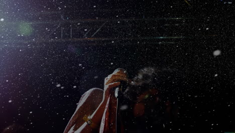 female singer gripping microphone on dark stage, performing music industry with animated confetti