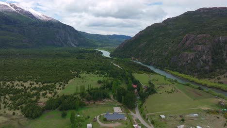 aerial view of chile - argentina customs border on valley floor beside futaleufu river