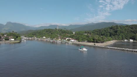 boat nears paraty breakwater in quaint brazilian costa verde town