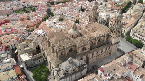 Spain-Jaen-Cathedral,-Catedral-de-Jaen,-flying-shoots-of-this-old-church-with-a-drone-at-4k-24fps-using-a-ND-filter-also-it-can-be-seen-the-old-town-of-Jaen