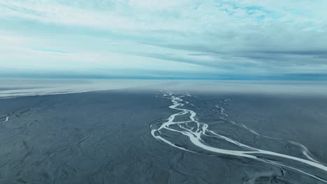 braided glacial river over black sand in south iceland