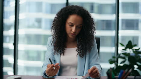 Focused-businesswoman-discussing-work-results-using-video-conference-close-up