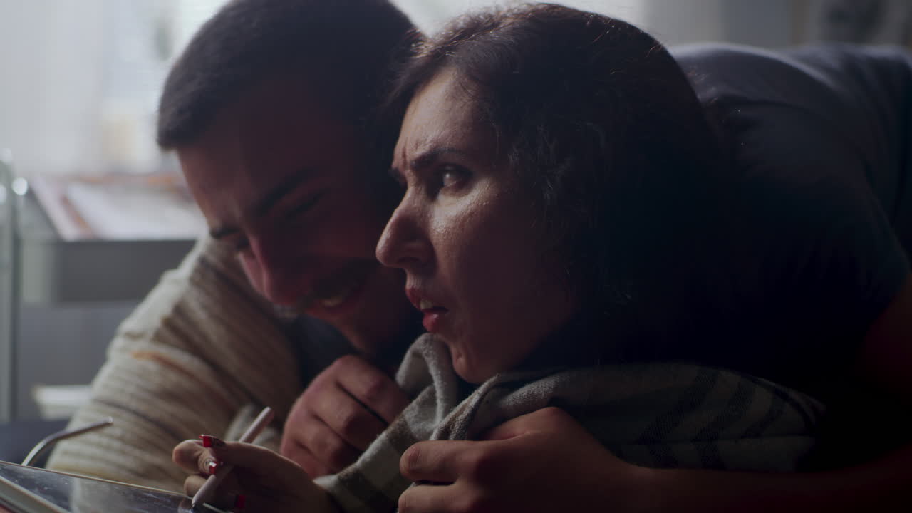 Couple Working Together on a Tablet