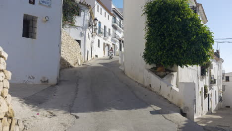 scenic spanish village street with white buildings