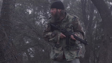 a camouflaged hunter quietly moves in the cold misty forest, armed with a weapon, listening for wild animals, 23