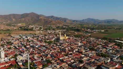 Aerial-Above-City-Of-Tamazula-de-Gordiano-With-View-Of-Diocesan-Sanctuary-of-Our-Lady-of-the-Sagrario