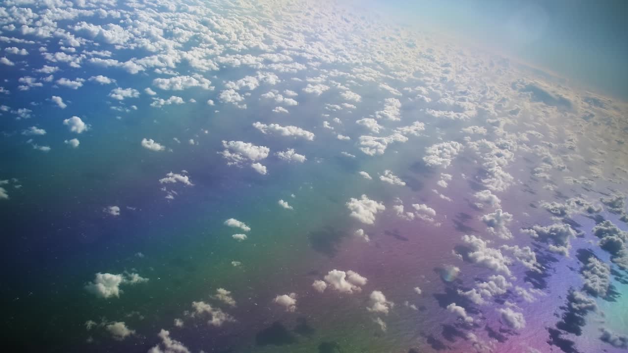 Colorful sea with cirrocumulus clouds from above in the atlantic ocean in a dreamy mood