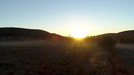 sunrise over a misty valley and farmland