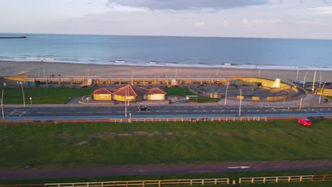 a panning shot from a drone of the coastline at south shields beach in the uk