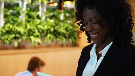 businesswoman using digital tablet in office