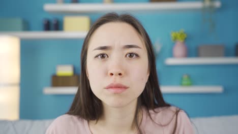 close-up portrait of angry and angry asian woman.